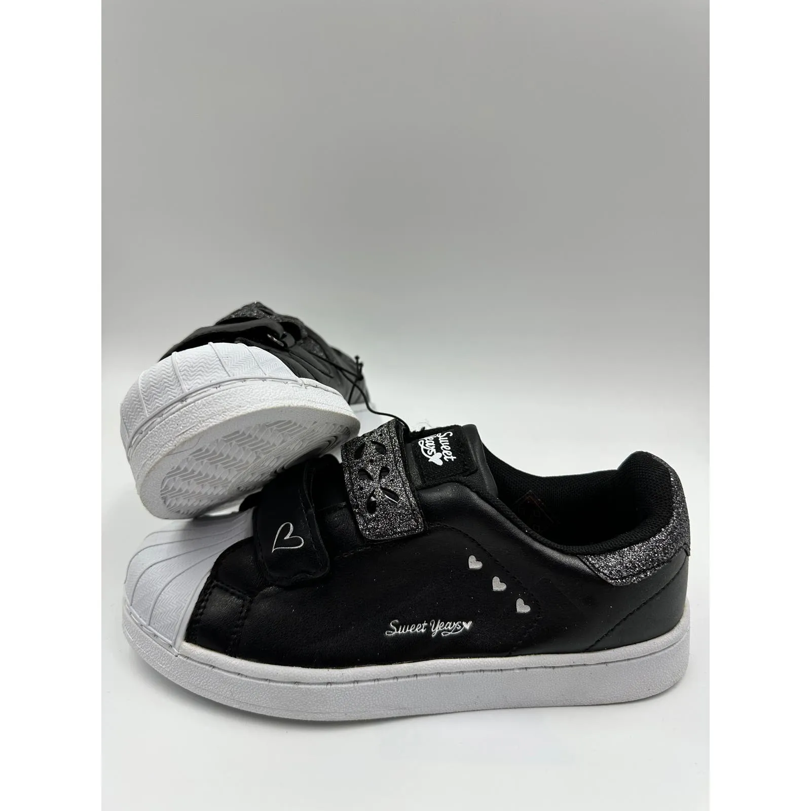 Big Kid Size 4, Black Sneakers with White Toe and Straps with Some Heart Details